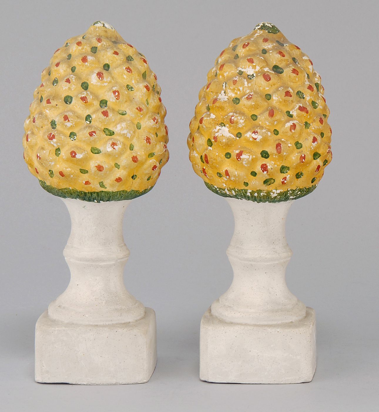 Appraisal: PAIR OF PINEAPPLE-FORM CHALKWARE NEWEL POST FINIALS Height