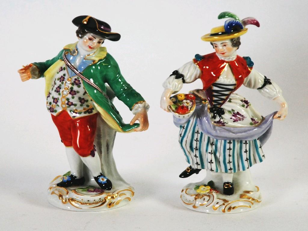 Appraisal: PAIR OF TWENTIETH CENTURY MEISSEN PORCELAIN FIGURES Lady with bowl