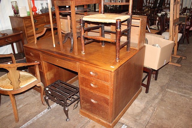 Appraisal: A MID TH CENTURY OAK DESK with drawers around a