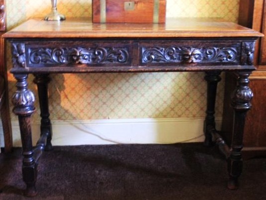 Appraisal: A thC Jacobean revival oak side table with two frieze