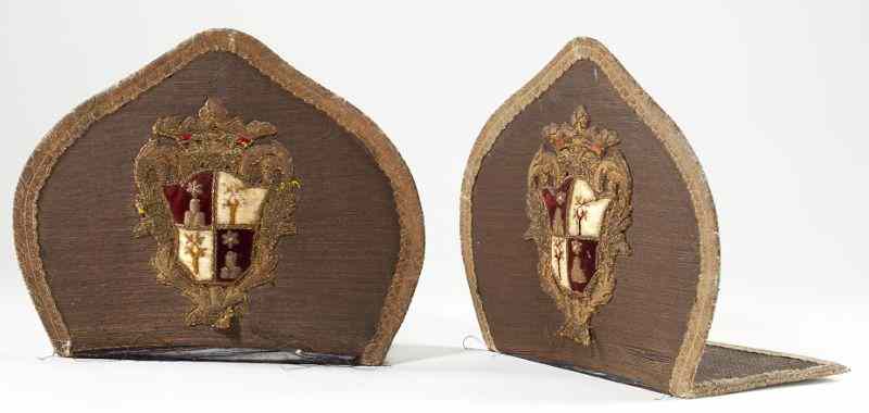 Appraisal: Antique Family Crest Bookendspair of metal bookends upholstered in gold