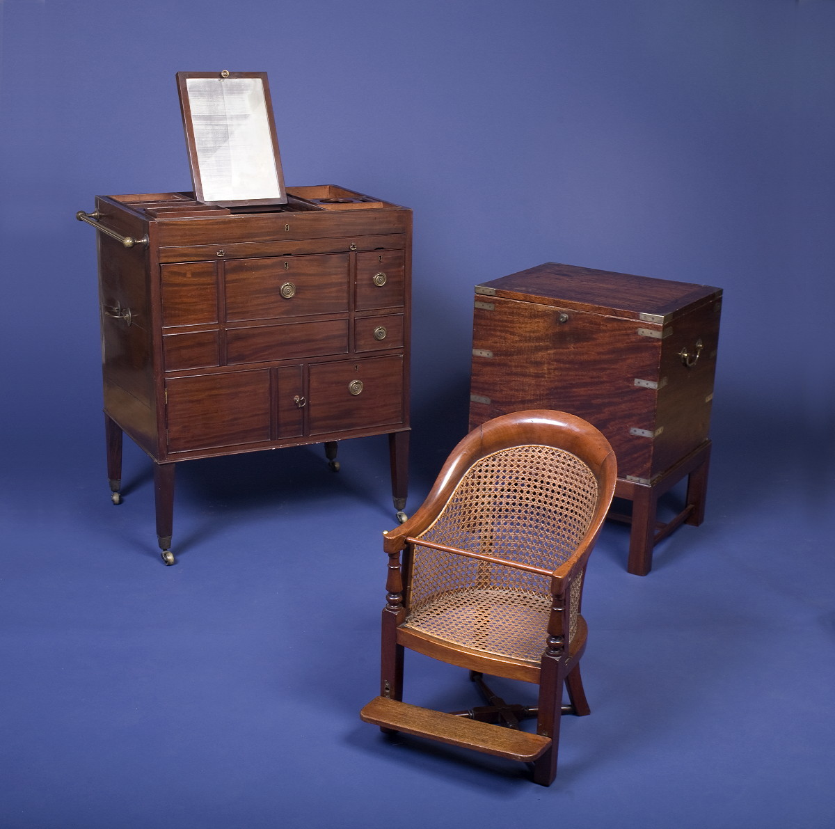 Appraisal: MAHOGANY BRASS AND WICKER CHILD'S CAMPAIGN CHAIR WITH ADJUSTABLE FOOTREST