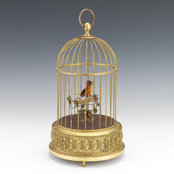 Appraisal: GERMAN SINGING BIRD AUTOMATON IN CAGE x Mechanical singing bird