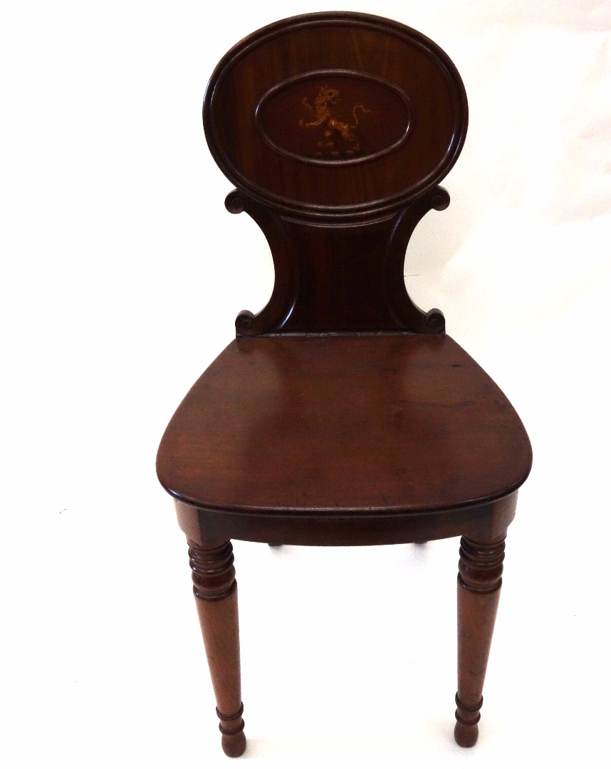 Appraisal: A George III mahogany hall chair the moulded oval back