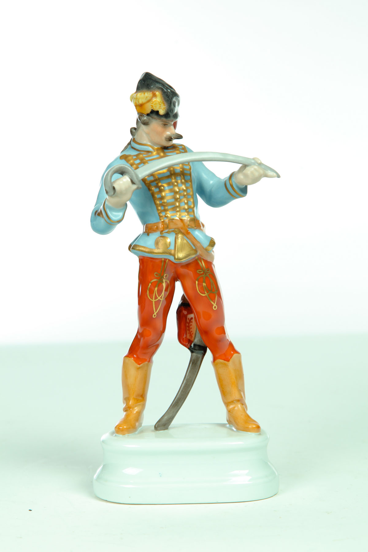 Appraisal: FIGURINE BY HEREND Hungary th century Hussar with sword Marked