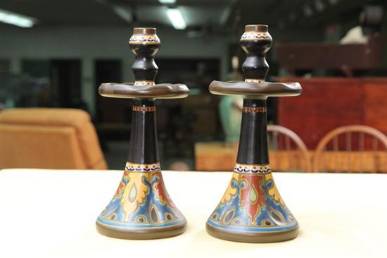 Appraisal: PAIR OF GOUDA POTTERY CANDLESTICKS Circa Tapered and faceted sticks