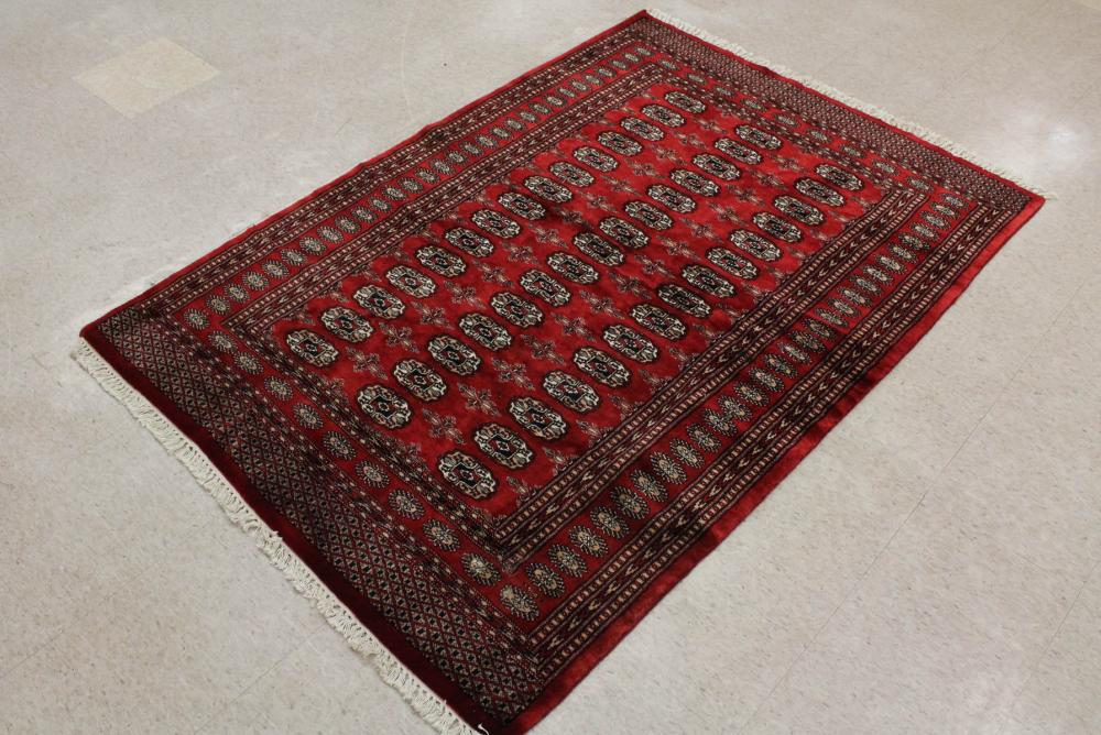 Appraisal: RED FIELD BOKHARA AREA RUG hand knotted ' x '