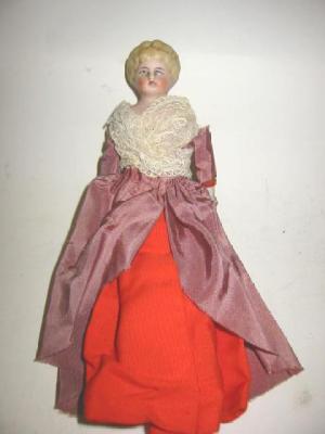 Appraisal: A bisque shoulder head dolls house doll with painted face