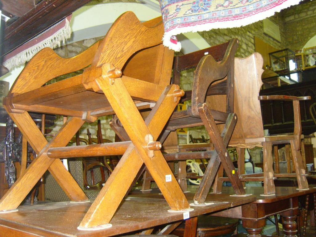 Appraisal: Two similar oak Glastonbury style chairs with shaped arms and