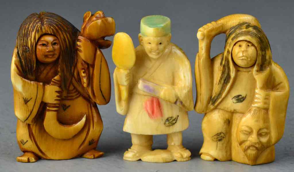 Appraisal: Japanese Carved Ivory NetsukeTo include two examples depicting witchs together