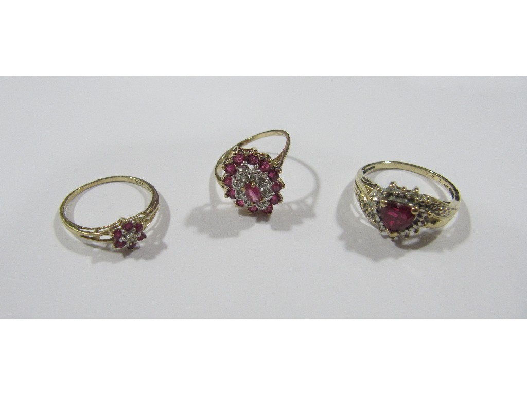 Appraisal: Lot comprising two ct gold ruby and diamond cluster rings