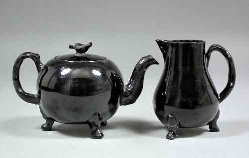 Appraisal: An th Century English black glazed Jackfield globular shaped teapot