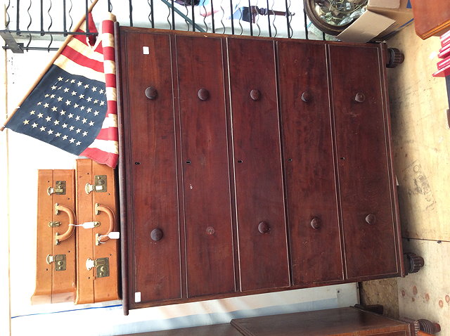 Appraisal: A VICTORIAN MAHOGANY OVERSIZED CHEST of five long drawers with