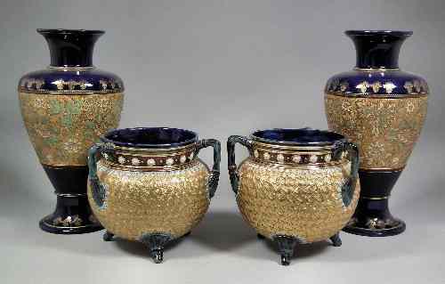 Appraisal: A pair of Doulton Lambeth stoneware jardinieres modelled as cauldrons