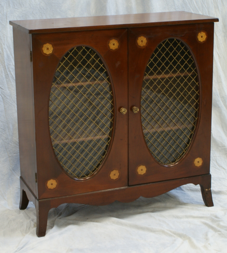 Appraisal: Inlaid mahogany door side cabinet with oval grill work doors