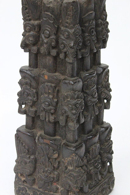 Appraisal: A CARVED WOOD TABLE LAMP decorated with the faces of