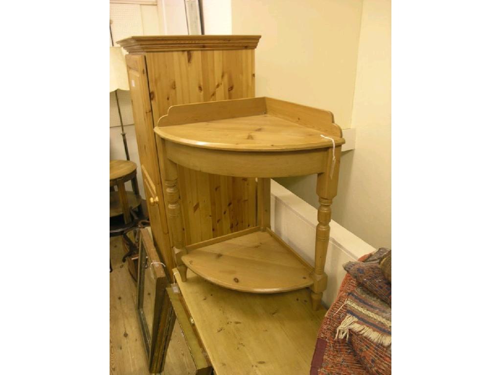 Appraisal: A waxed pine corner-fitting wash stand two-tiered on turned legs