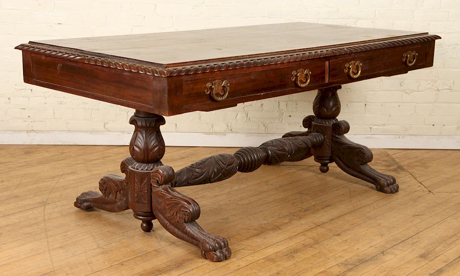 Appraisal: RENAISSANCE REVIVAL STYLE WALNUT TRESTLE TABLE An American mahogany Empire