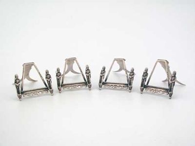 Appraisal: A set of four Victorian menu or place card holders