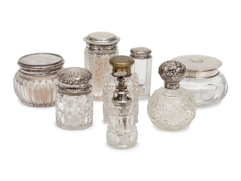 Appraisal: A Group of Six Silver or Brass Capped Glass Bottles