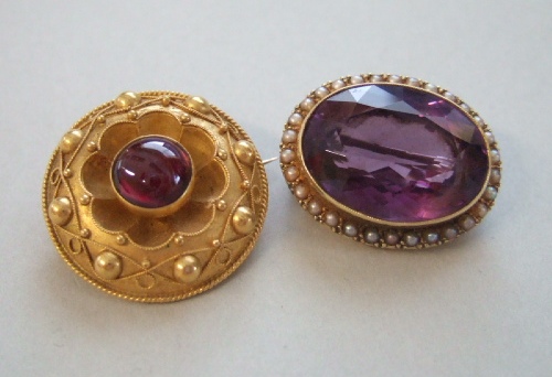 Appraisal: An amethyst and half pearl set oval brooch mounted with