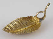 Appraisal: A silver gilt leaf shaped caddy spoon with snake tendril