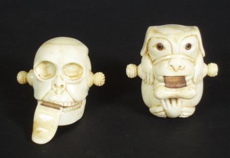 Appraisal: Two novelty tape measures comprising a skull with tongue shaped