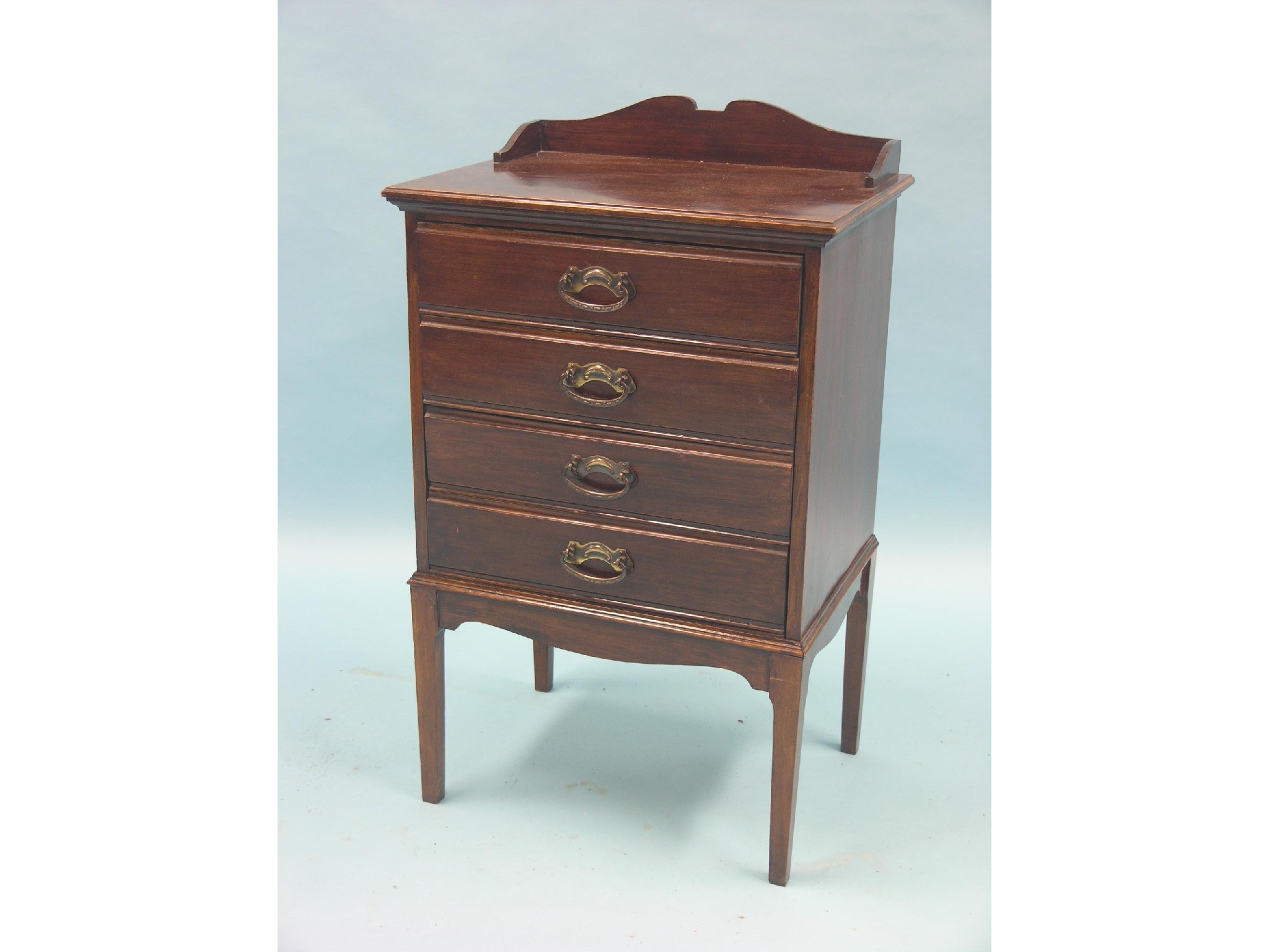 Appraisal: An Edwardian mahogany music chest four fall-front drawers ft in