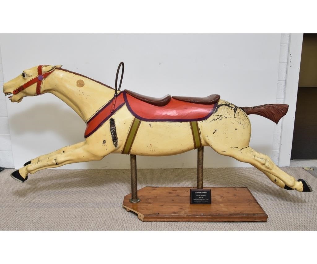 Appraisal: Double-seated red and yellow carousel horse mounted on a wood