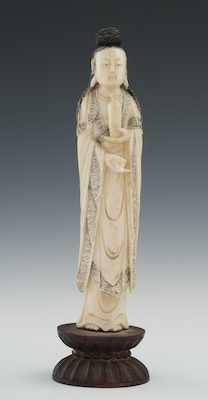 Appraisal: A Carved Ivory Figure of a Goddess Standing on a