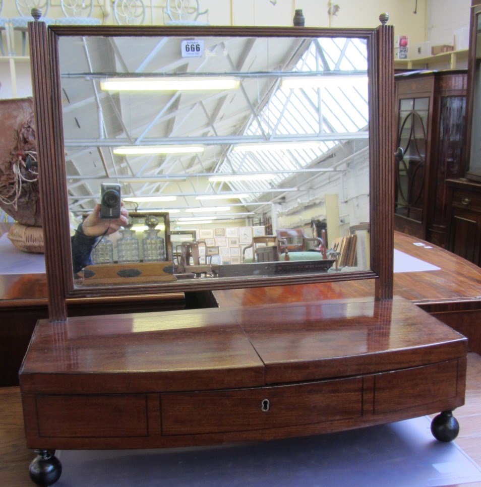 Appraisal: A th century and later mahogany toilet mirror the bow