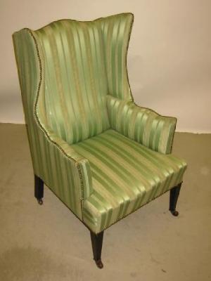 Appraisal: A MAHOGANY FRAMED WING ARMCHAIR of Georgian design upholstered in