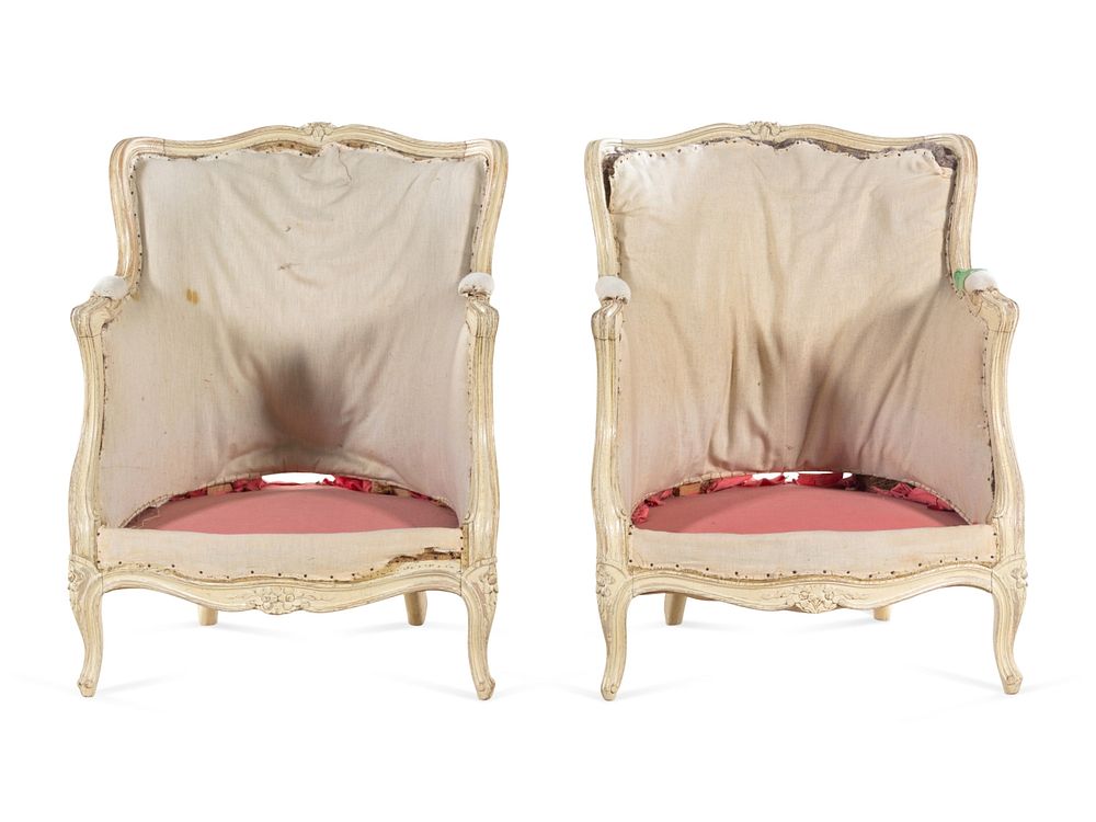 Appraisal: A Pair of Louis XV Carved and White-Painted Low Bergeres