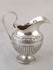 Appraisal: A Danish silver milk jug the oval body half ribbed