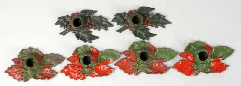 Appraisal: Lot of Pairs of Cast Iron Candle Holders Description Poinsettia