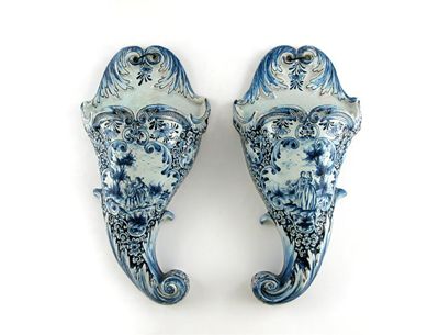 Appraisal: A pair of Dutch Delft cornucopia wall pockets painted in