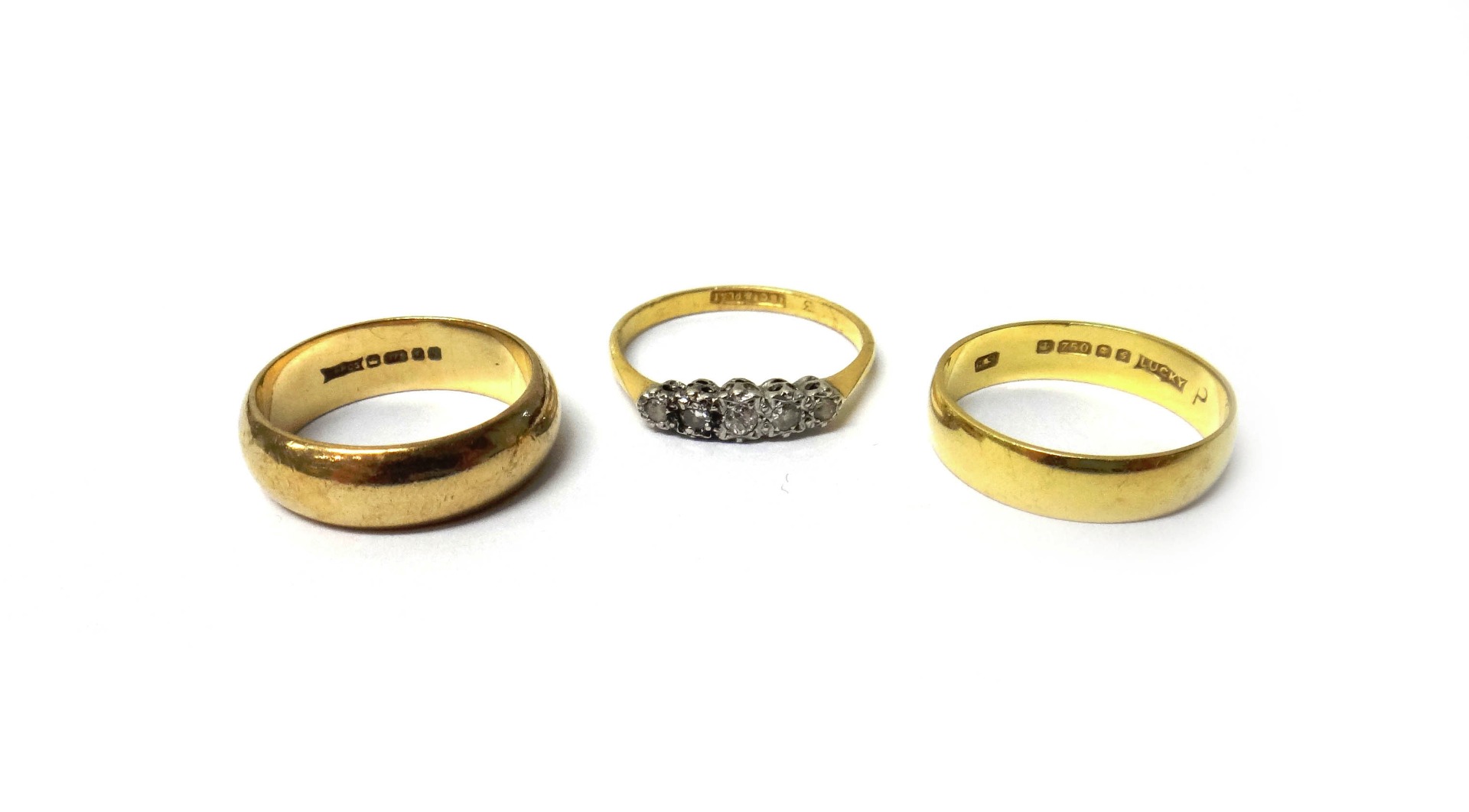 Appraisal: A gold and platinum diamond set five stone ring detailed