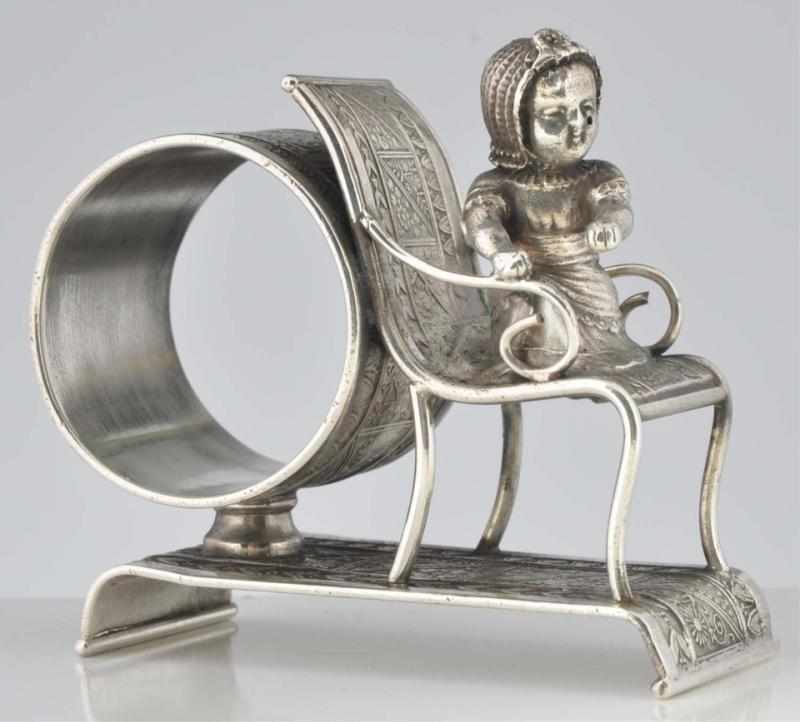 Appraisal: Kate Greenaway Baby in Chair Figural Napkin Ring By Middletown