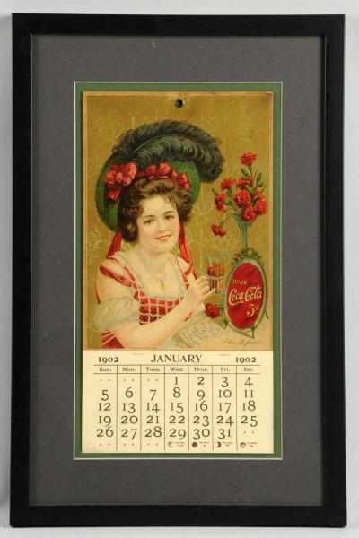 Appraisal: Coca-Cola Calendar Framed under glass Slightly darkened with small spot