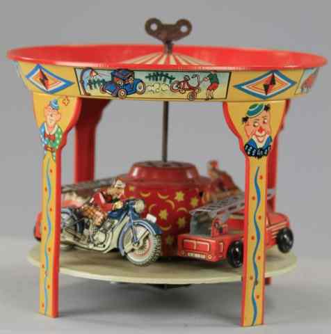 Appraisal: AMUSEMENT CAROUSEL WITH CYCLES AND FIRE TRUCKS Hoch Beckman Mfg