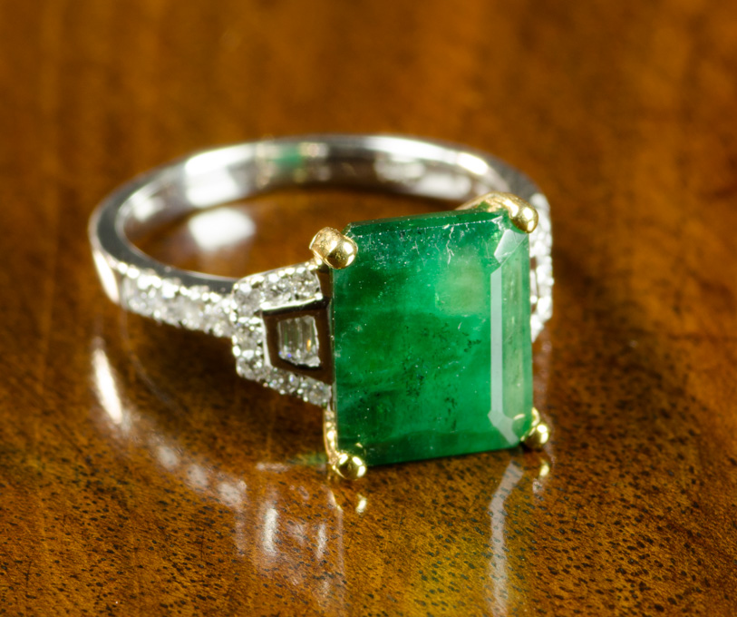 Appraisal: EMERALD AND DIAMOND RING ct emerald-cut emerald on K white