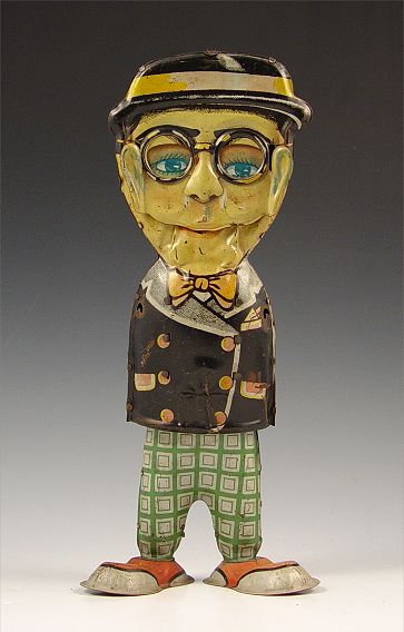 Appraisal: HAROLD LLOYD WIND UP HAPPY FACE TIN TOY Circa Moving