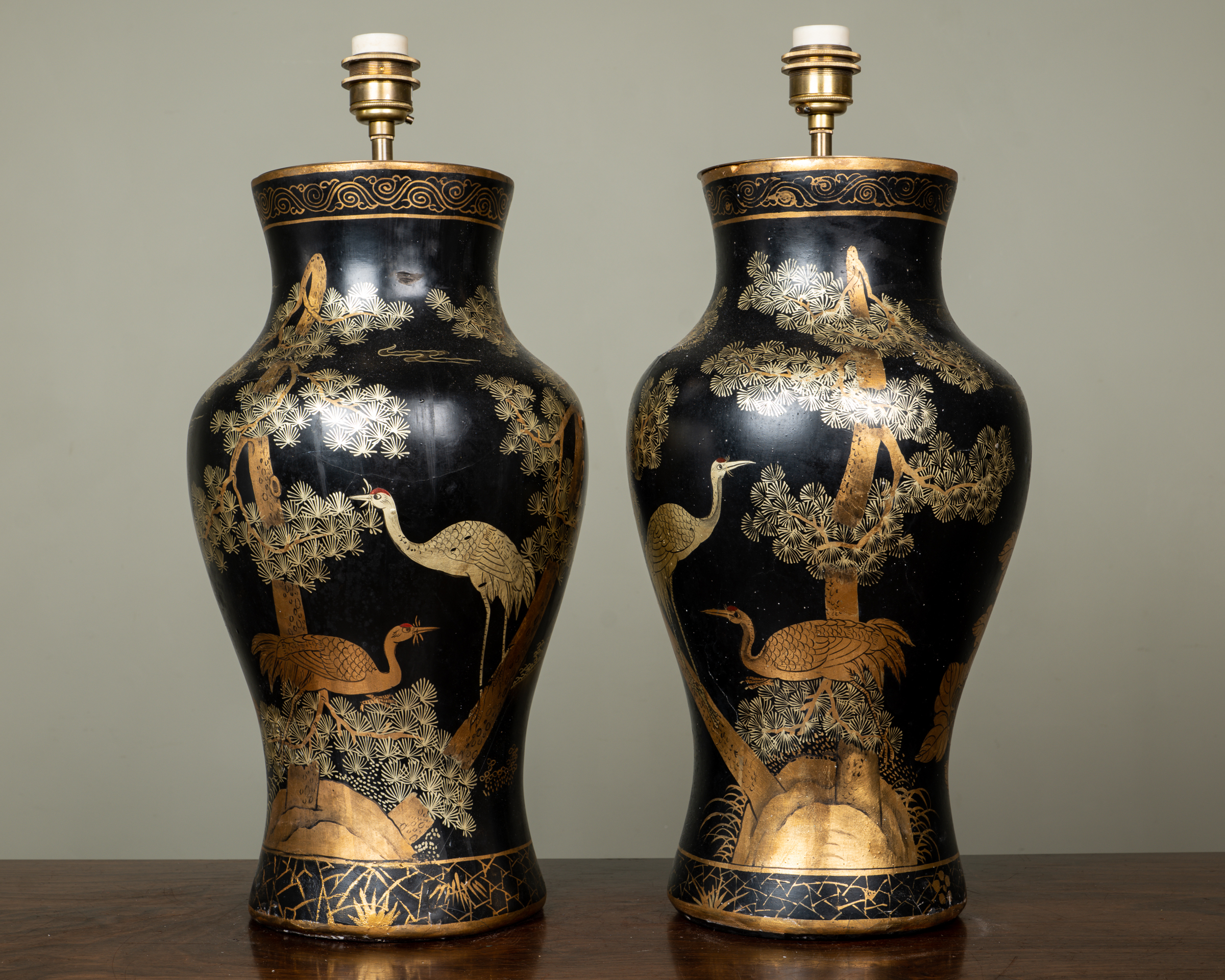 Appraisal: A pair of chinoiserie decorated papier-m ch table lamps of