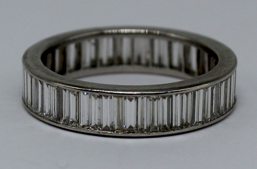 Appraisal: JEWELRY Platinum and Diamond Baguette Eternity Band Accompanied by a