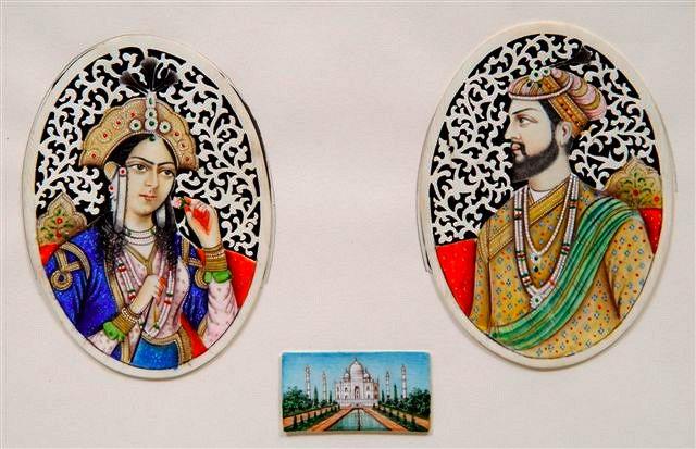 Appraisal: A PAIR OF INDIAN CARVED AND PAINTED IVORY OVAL PORTRAIT