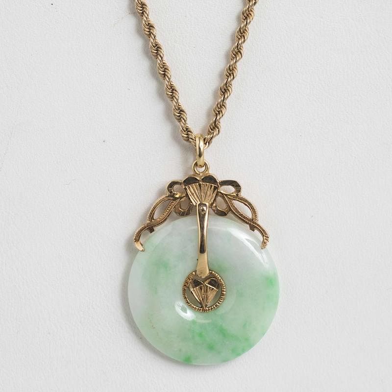 Appraisal: Chinese Jade k Necklace Chinese jade pendant on k chain