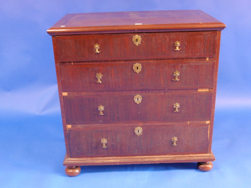 Appraisal: A th century continental walnut chest of four cross-banded drawers