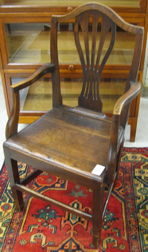 Appraisal: GEORGE III OAK ARMCHAIR English early th century The chair's