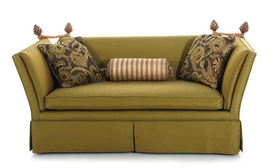 Appraisal: Baker Knole upholstered sofa decorated with pineapple finials and tassels