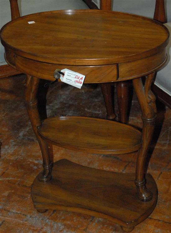 Appraisal: OVAL STAND Biedermeier style cherry bird supports fitted with drawer